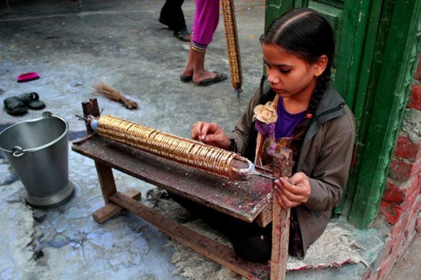 <p>1. Spirals of bangles lie in mounds in unkempt yards</p><p>2. Dark hutments</p><p>3. Lines of flames of flickering oil lamps</p><p>4. Boys and girls sit with their fathers and mothers</p><p>5. Welding pieces of coloured glass into circles of bangle</p><p>6. Eyes more adjusted to the dark than to the light outside</p><p>7. Often lose their eyesight before becoming adults</p>