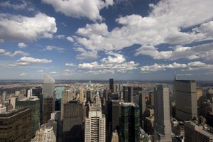 <ul><li><p>The horizon line separates earth from sky. Objects on the ground that are higher toward the horizon line are perceived as being farther away than objects that are lower. Objects in the sky that are lower toward the horizon line are perceived as being farther away than objects that are higher.</p></li><li><p>We perceive the buildings near the horizon line in the middle of this photo as being farther away than the buildings that are at the bottom of the photo. We perceive the clouds near the horizon line as being farther away than the clouds that are at the top of the photo.</p></li></ul><p></p>