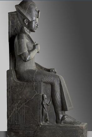 <p><span>Ramesses II</span><br><span>Dynasty 19</span><br><span>granodiorite</span><br><span>Karnak</span></p><p><span>Smaller waist, slim &amp; fit, not scary, kingly outfit—would be white which also shows status (clean &amp; in a desert), figurine at the bottom—is a child (shaved head &amp; ponytail), hieratic scale</span></p>