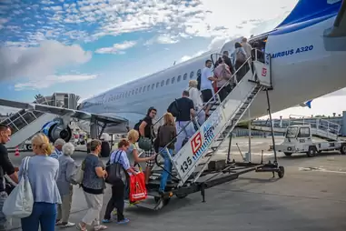 to get onto or allow people to get onto a boat, train, or aircraft