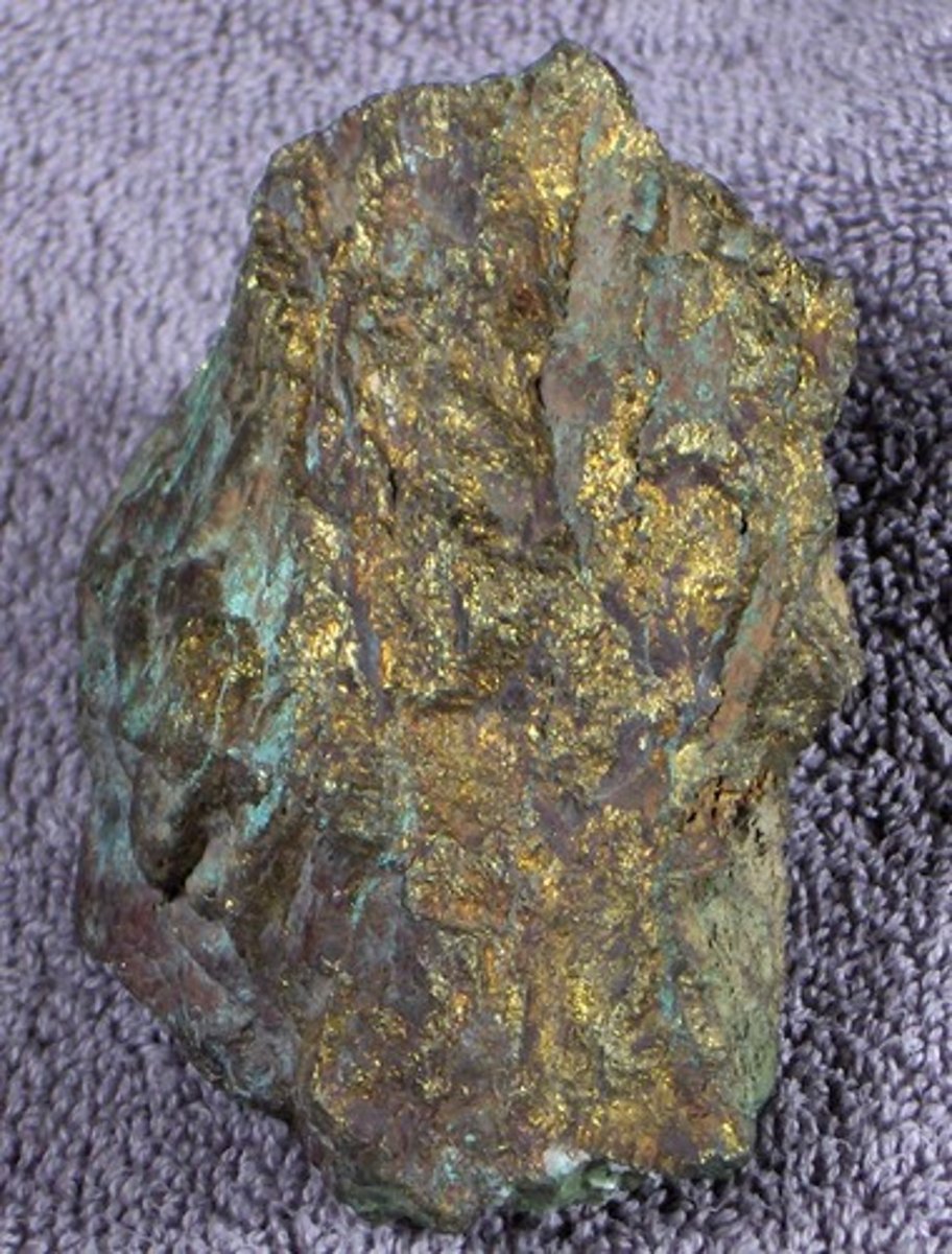 <p>Metallic mineral; brassy to golden yellow, may tarnish to iridescent purple &amp; blue, hardness 3.5-4, greenish black streak</p>