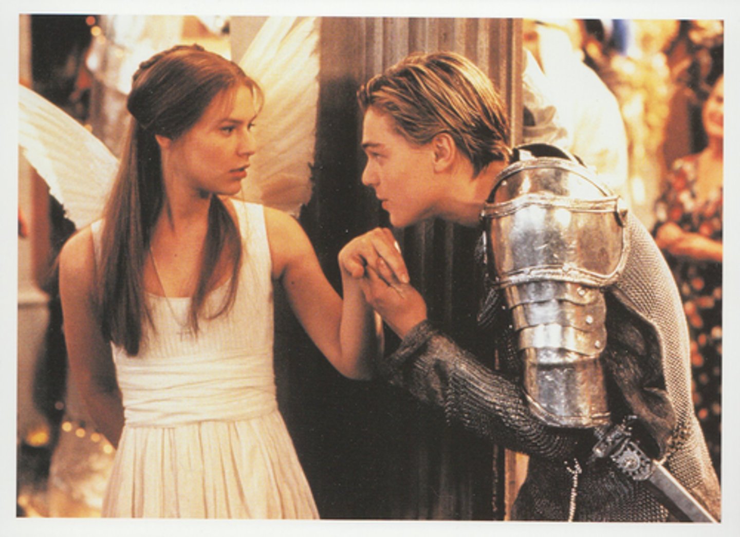<p>In this scene, Romeo holds Juliet's gaze with intensity and desire. He positions his body lower so that he has to gaze up at her while at the same time grasping her hand tightly. His body and his facial expression communicate both a desire for Juliet and a recognition of his own position as an outsider.</p>