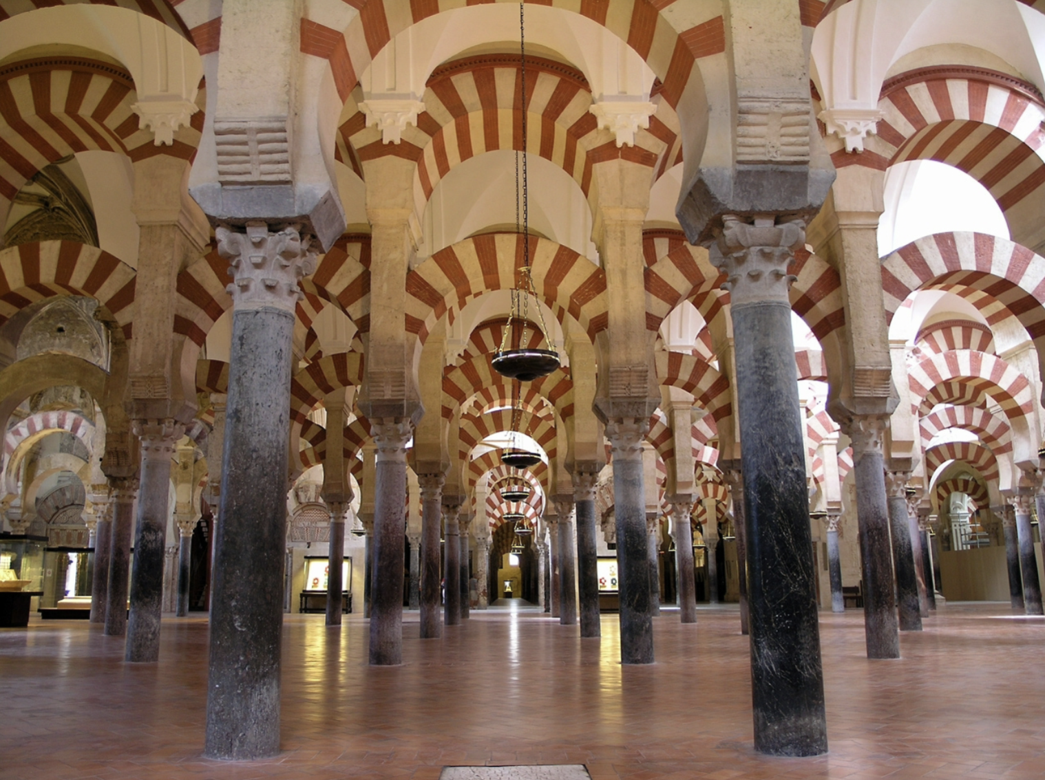 <ul><li><p><strong>Cultural power</strong>: asserting Umayyad authority through its construction on a former Christian site and use of spolia</p></li><li><p><strong>Artistic innovation</strong>: blending Islamic, Byzantine, and Spanish elements like horseshoe arches, ribbed ceilings, and intricate mosaics</p></li><li><p>S<strong>piritual symbolism</strong>: with features like the mihrab and Qur’anic inscriptions emphasizing divine guidance and reflection</p></li></ul><p></p>