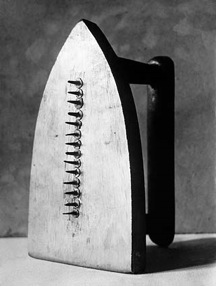 * another readymade which becomes a violent statement 
* it is a refusal to conformity due to the iron lacking its ability to iron 
* this work was erotic as Man Ray used it to iron an eighteen-year-olds dress with it to observe her body as she danced 
* he was either destabilizing the female stereotype of a housewife or sexualizing females by imagining their clothes shredded 