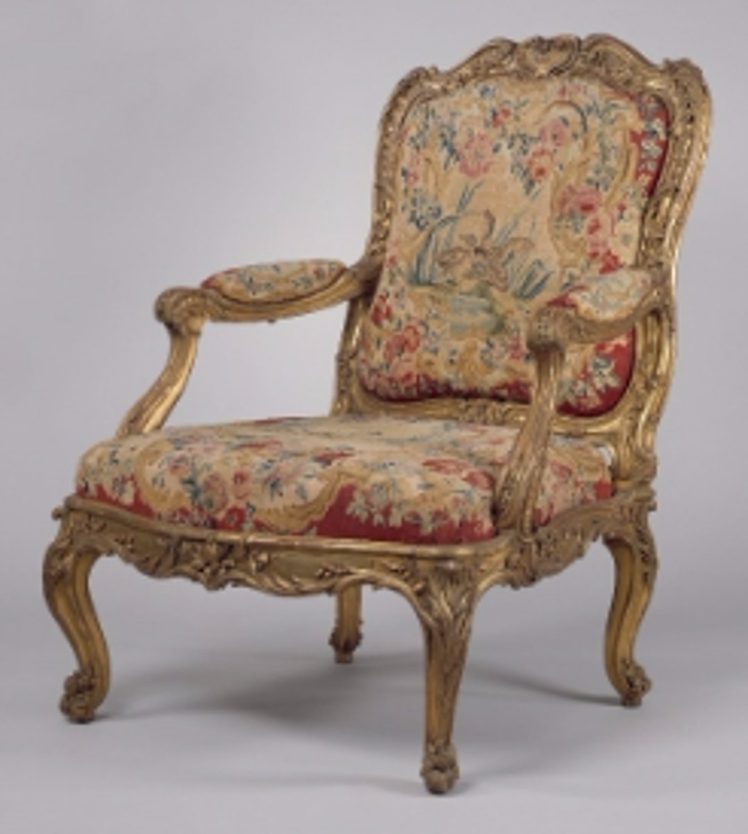 <p>By the reign of Louis XV (1715 - 1774), chairs had evolved to take on more curvaceous shapes, with slanted backs and bowed cabriole legs. Upholstery on these chairs often emphasizes their shape, with curve-shaped edges and oval tufts on the armrests.</p>