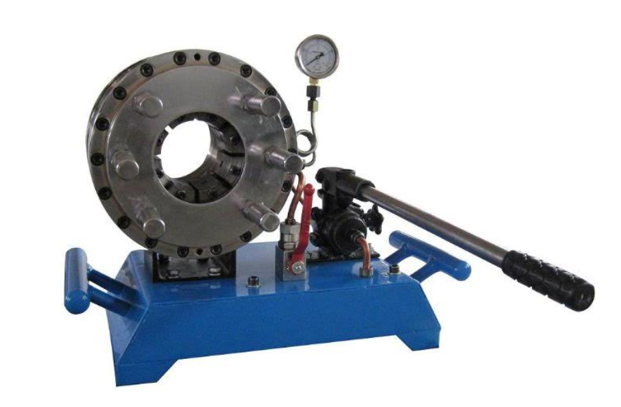 The machine pictured is able to crimp a fitting on the end of a hydraulic hose so that it can handle very high pressures. What type of process is being employed by the machine?