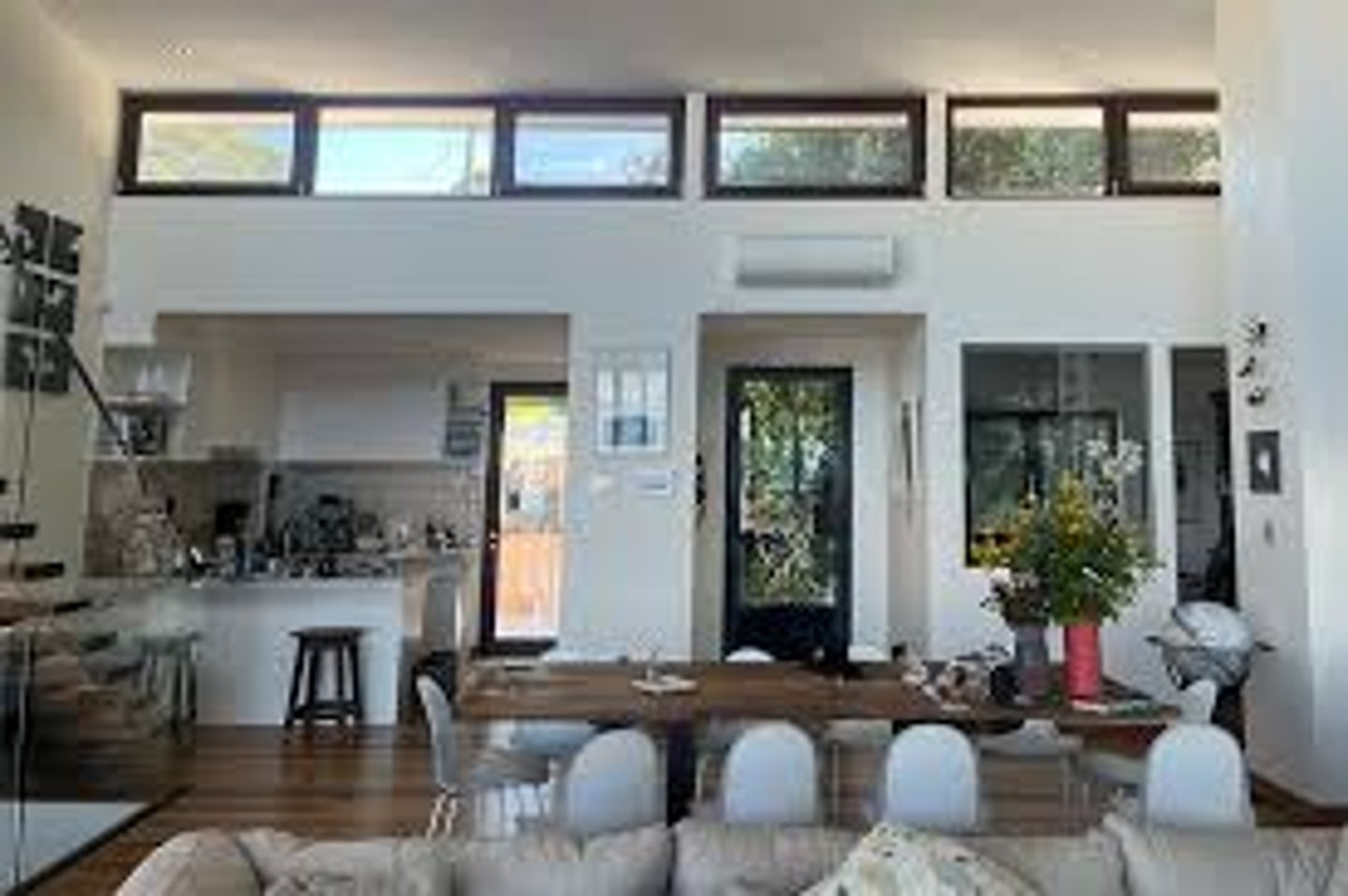 <p>A portion of an interior rising above adjacent rooftops and having windows to admit daylight</p>