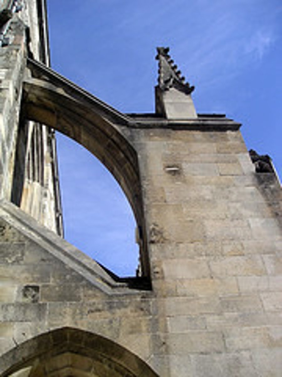 <p>a buttress forming from a sepperate pier, typically forming an arch with the wall it supports</p>