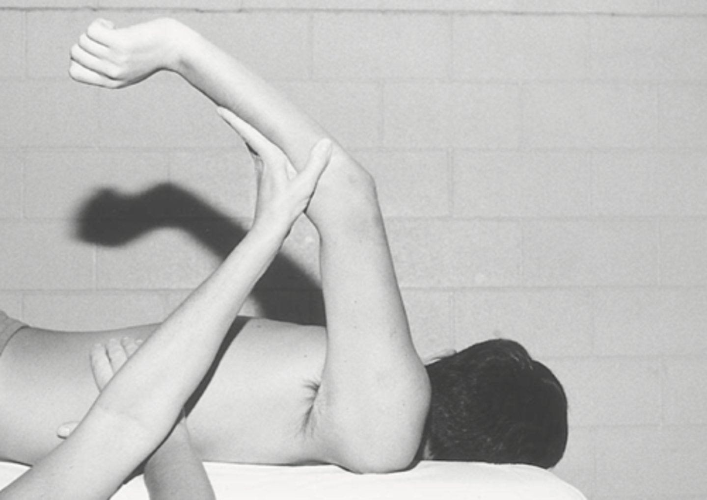 <p>Prone, palms facing body</p>
