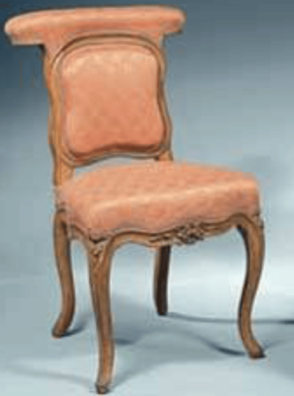 <p>What is a straddle chair, in which the sitter faces the chair back and rests their arms on the upholstered top rail?</p>