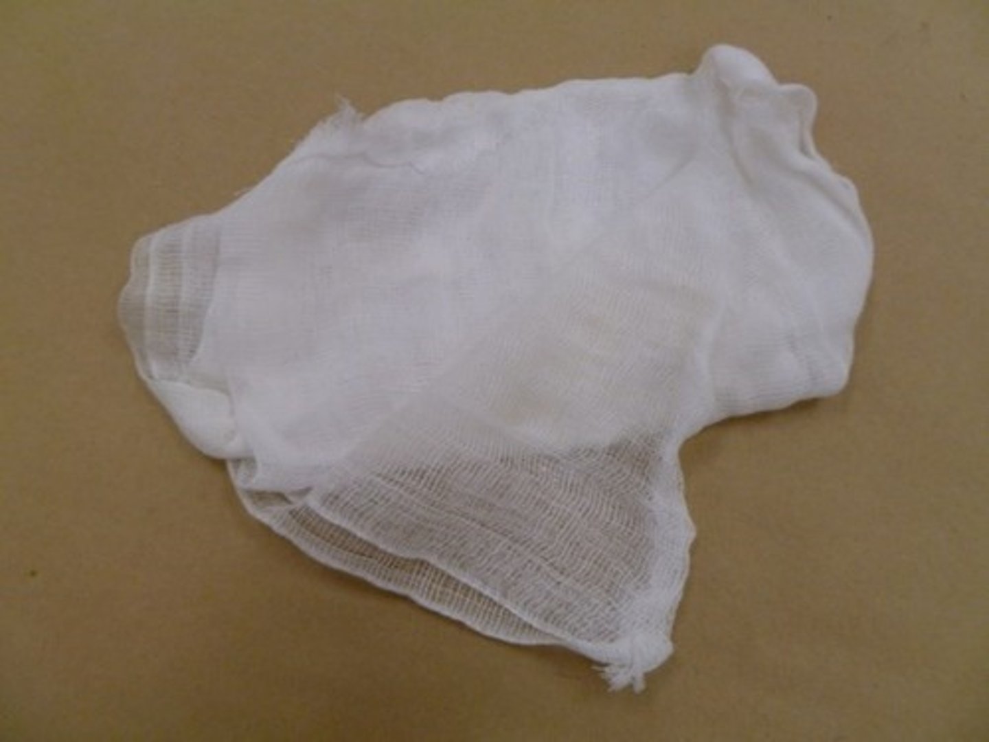 <p>A light, fine mesh gauze for straining liquids, such as stocks or custards, for bundling herbs, or for thickening yogurt.</p>