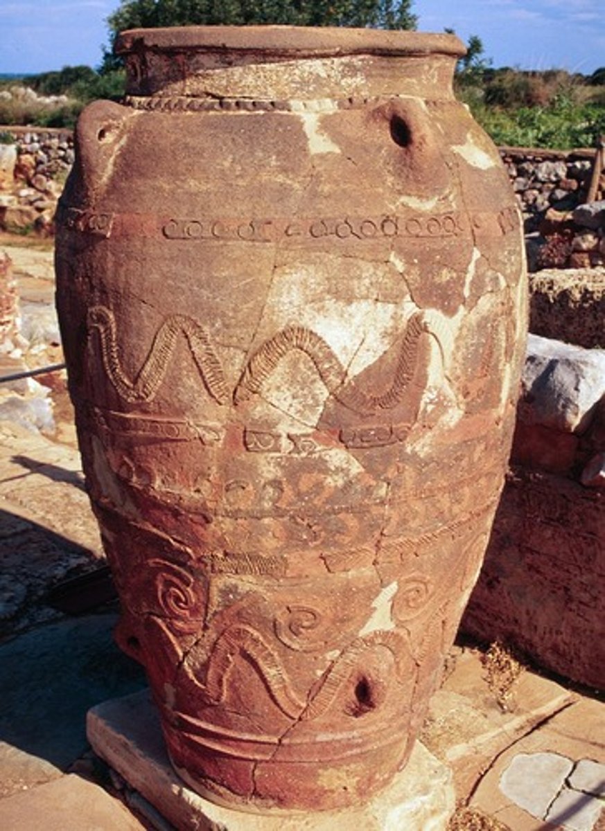 <p>- Large ceramic storage jars used throughout the ancient Aegean, Near East, and Mediterranean</p><p>- Could be 1-2 meters tall and hold hundreds of liters of oil, grain, wine, or other goods</p><p>- Found in large numbers in Minoan palace storerooms, indicating centralized economic control</p><p>- Made using coil-building technique and often decorated with rope-pattern reliefs</p><p>- Crucial evidence for understanding ancient economies and redistribution systems</p>