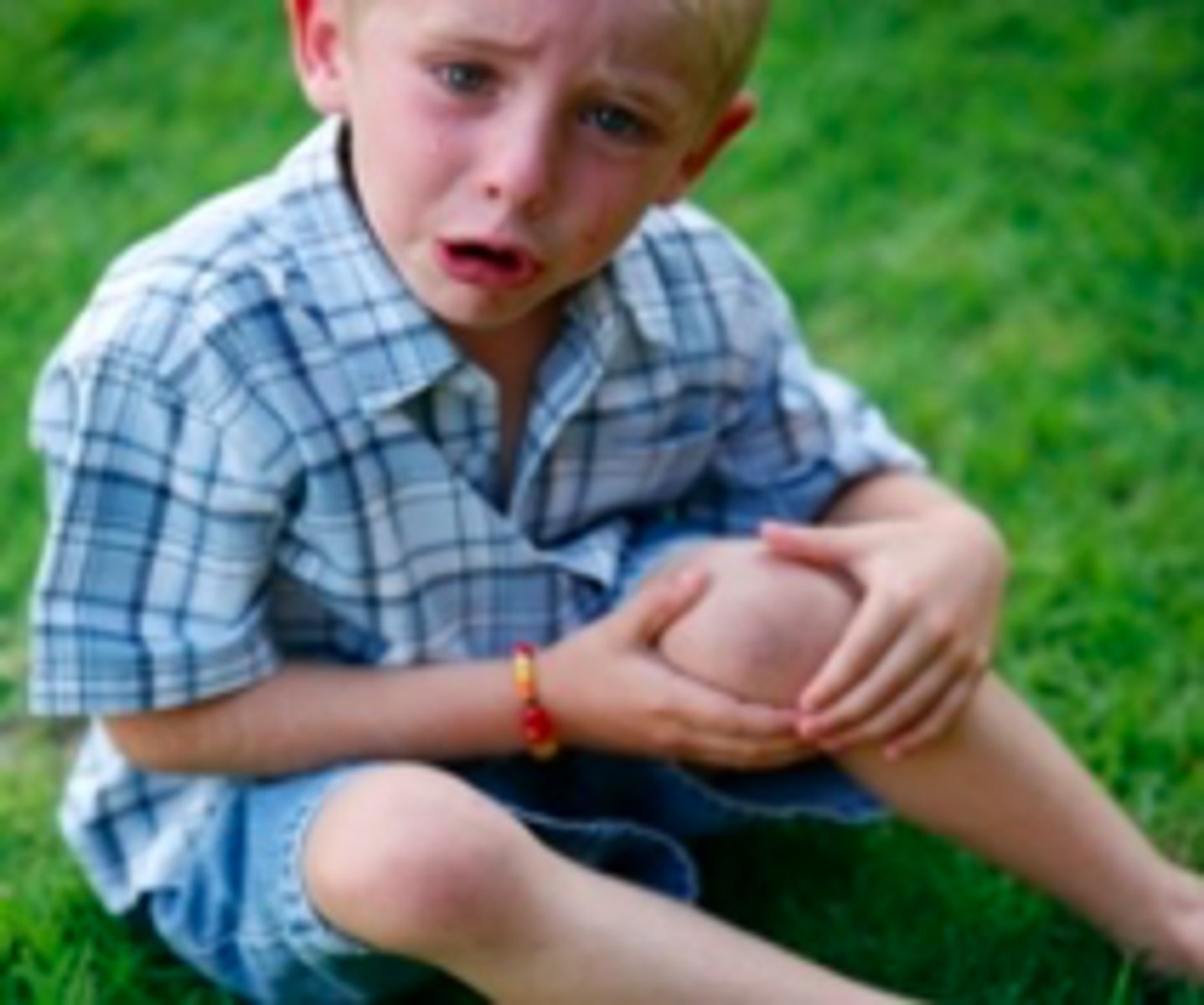 <p>When a child has "screwing up eyes and lowers the eyebrows," they are most likely experiencing ________</p>