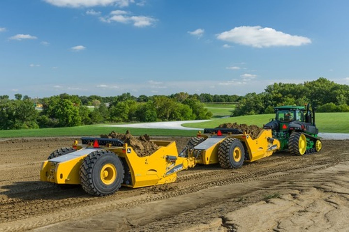 <p>The general purpose is to scrape and level surfaces or material import/export (relocation). As the machine moves forward, dirt is collected into the bowl where it eventually becomes full.</p>