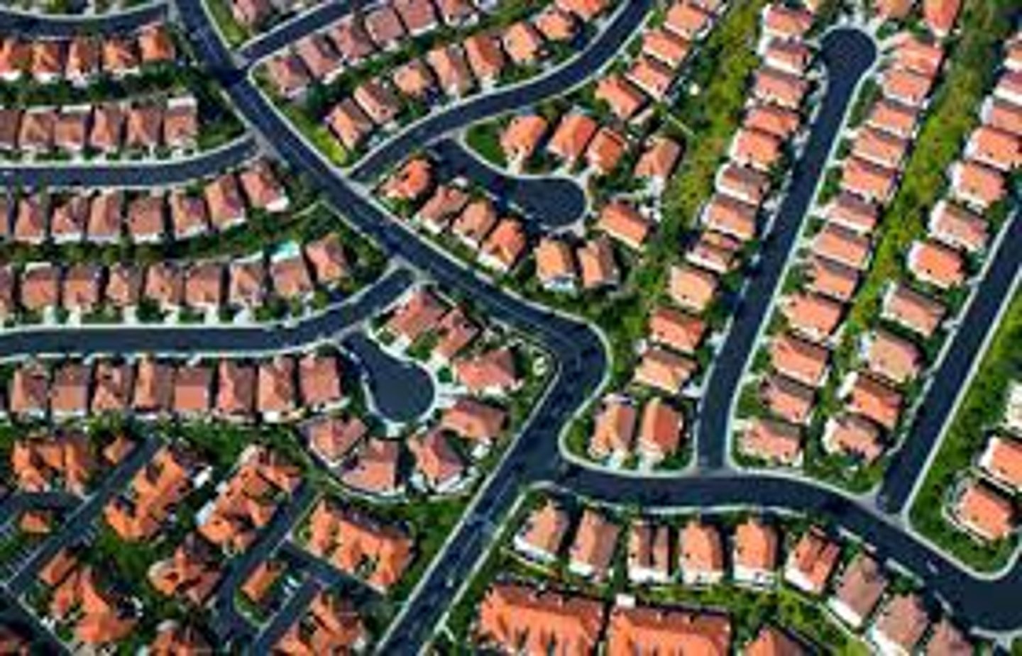 <p>urban areas ---> surrounding areas (cookie cutter houses)</p><p>results in the depletion of farmland or wilderness (urban decay)</p>