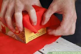 <p>to cover or enclose sth ,usually using paper, cloth, or material</p>